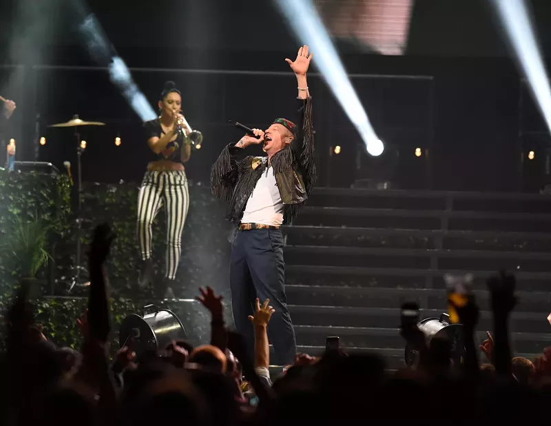 Image: Macklemore performs at American Airlines Arena. See more photos from Kesha and Macklemore at the American Airlines Arena here.