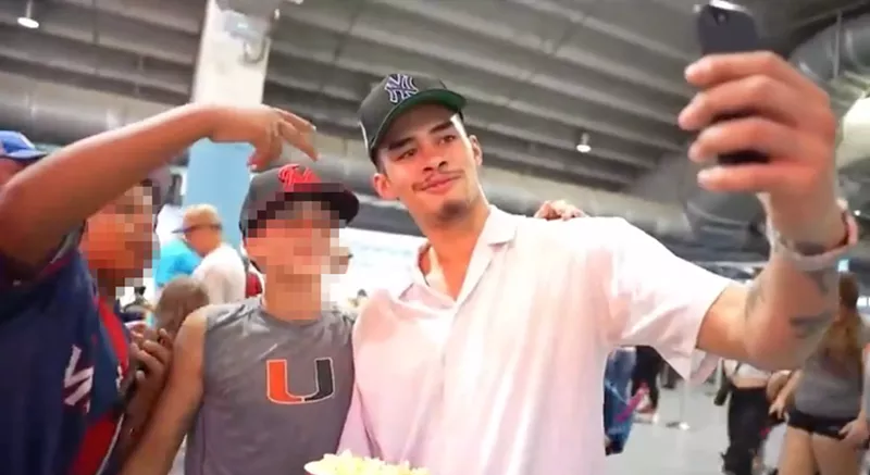 Image: Online streaming personality Nico Kenn De Balinthazy, AKA Sneako, poses for selfies at a Miami Marlins game at LoanDepot Park.