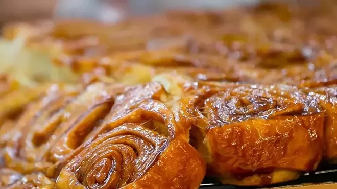 close up of cinnamon buns with glaze