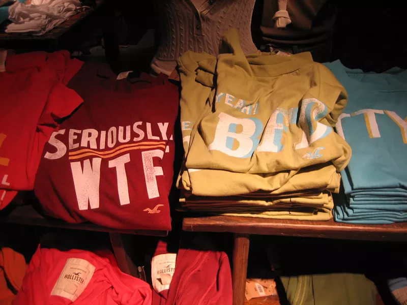Image: Stacks of T-shirts at a Hollister store.