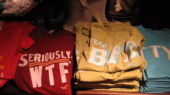 Stacks of T-shirts at a Hollister store.