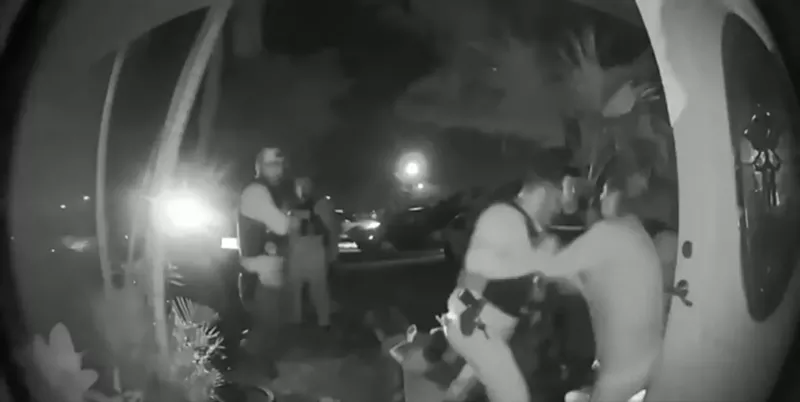 Image: Surveillance footage shows Sweetwater police officers raiding a family's home on January 9.