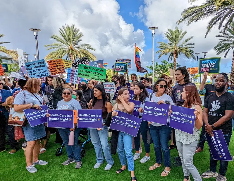 Image: Protesters gather outside the Marriott Fort Lauderdale Airport hotel where the Florida Board of Medicine held a meeting on August 5, 2022 to consider proposed rules to ban gender-affirming medical care for minors.