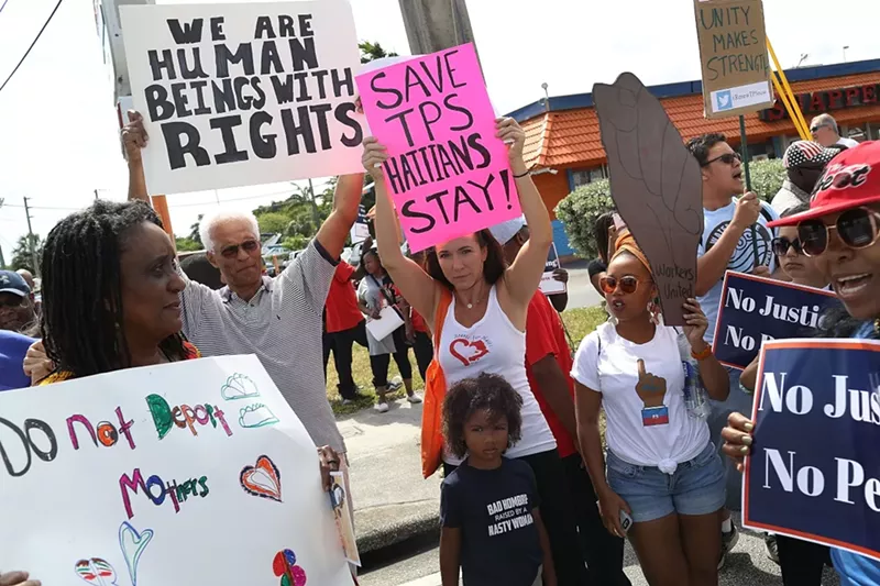 Image: Pro-immigration demonstrators protest in front of a federal office in Miami.