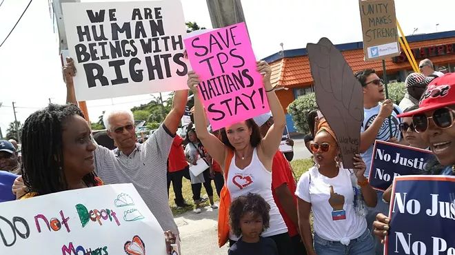 Pro-immigration demonstrators protest in front of a federal office in Miami.