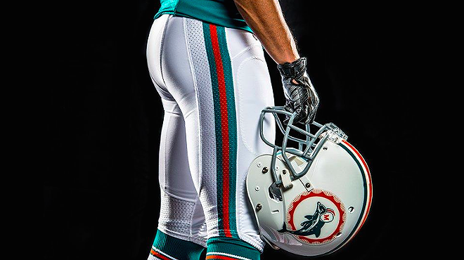 detail showing a Miami Dolphins throwback helmet and uniform pants