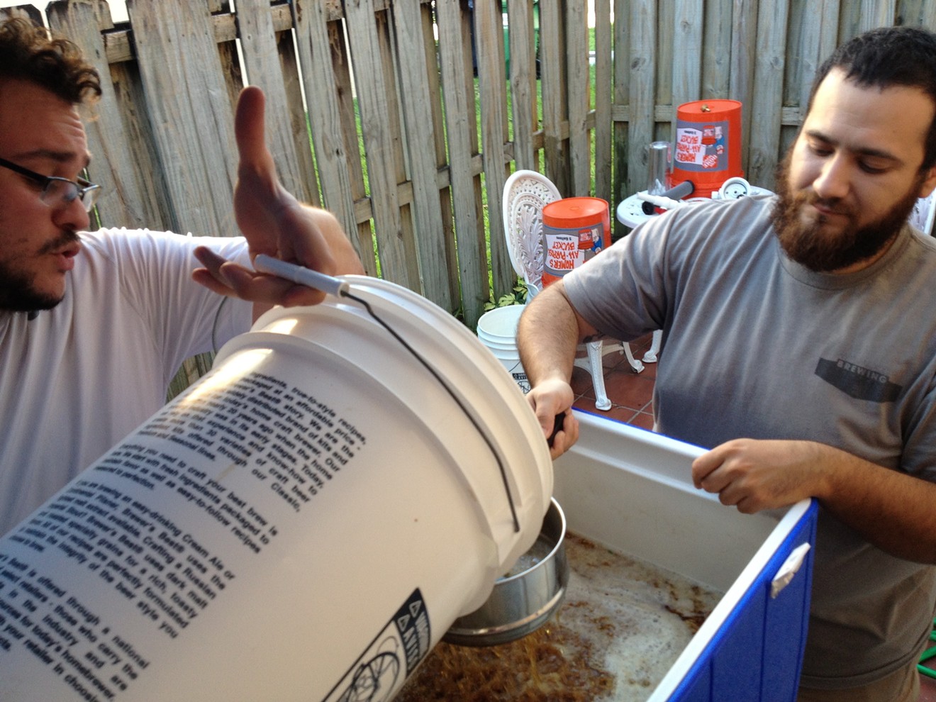 Lost City Brewing's Chris Campos (left) and Daniel Morales make a batch of brew at Campos' home in Miami.