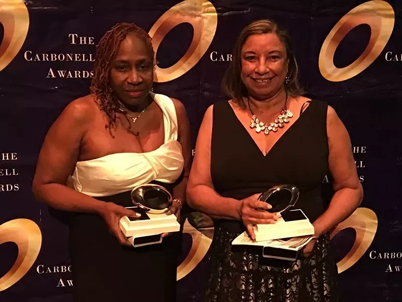 Image: Patricia E. Williams and Shirley Richardson posing with their Carbonell trophies in hand