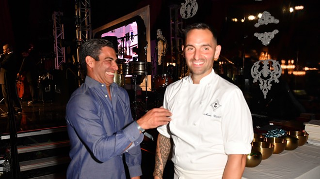 Miami Mayor Francis Suarez laughs while standing next to a popular chef