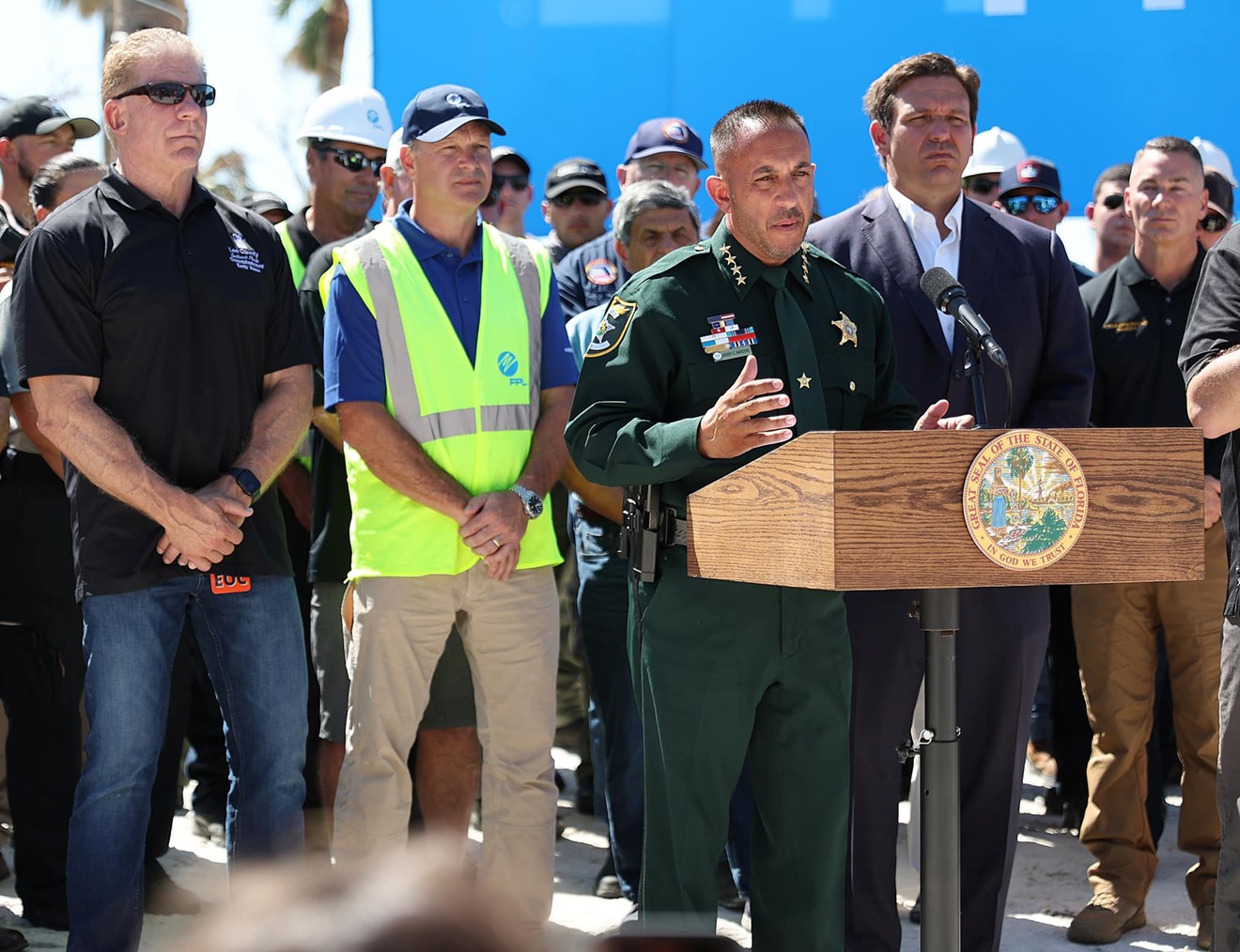 Gov. Ron DeSantis stands alongside Sheriff Carmine Marceno as they discuss the Hurricane Ian recovery effort.