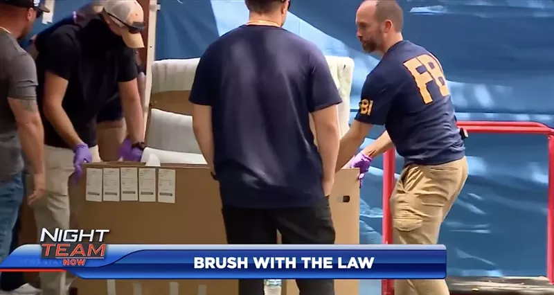 Image: Screenshot of tv coverage of FBI agents raiding a Coconut Grove art gallery