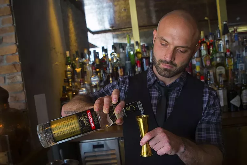 Image: Beaker & Gray's bar manager, Ben Potts, makes the restaurant's signature cocktail, the Halliwell.