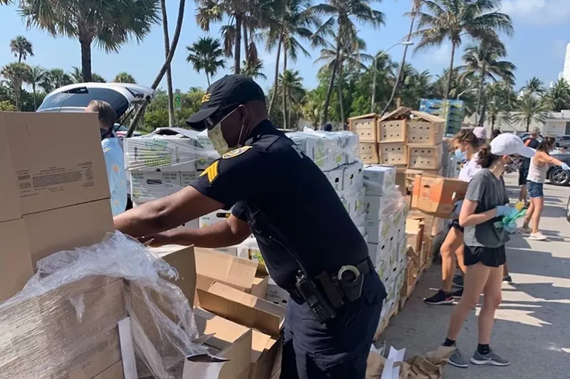 Image: Feeding South Florida and Miami Beach officials distribute food near Collins Park.