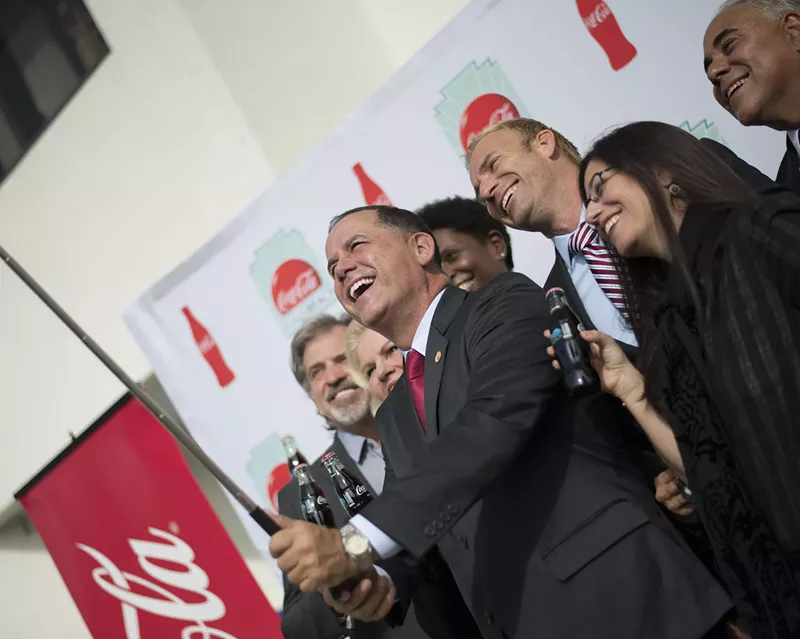 Image: Miami Beach Mayor Philip Levine takes a photo with a selfie stick.