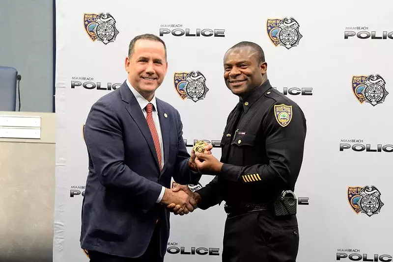 Image: Miami Beach Mayor Philip Levine (left) shakes hands with MBPD Maj. W. Anthony Jones.