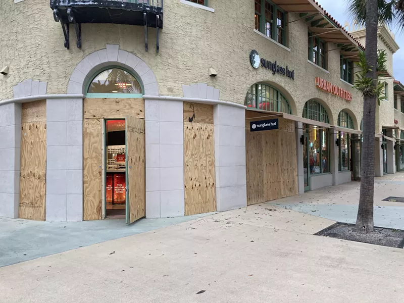 Image: Some Miami-Dade businesses are boarding up ahead of Election Day, including the Sunglass Hut in Miami Beach.