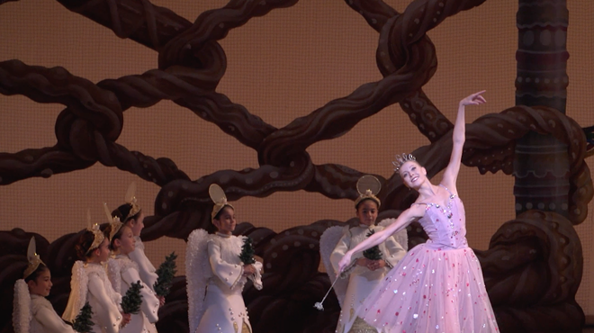 Miami City Ballet principal dancer Dawn Atkins dancing in The Nutcracker, surrounded by young dancers dressed as angels