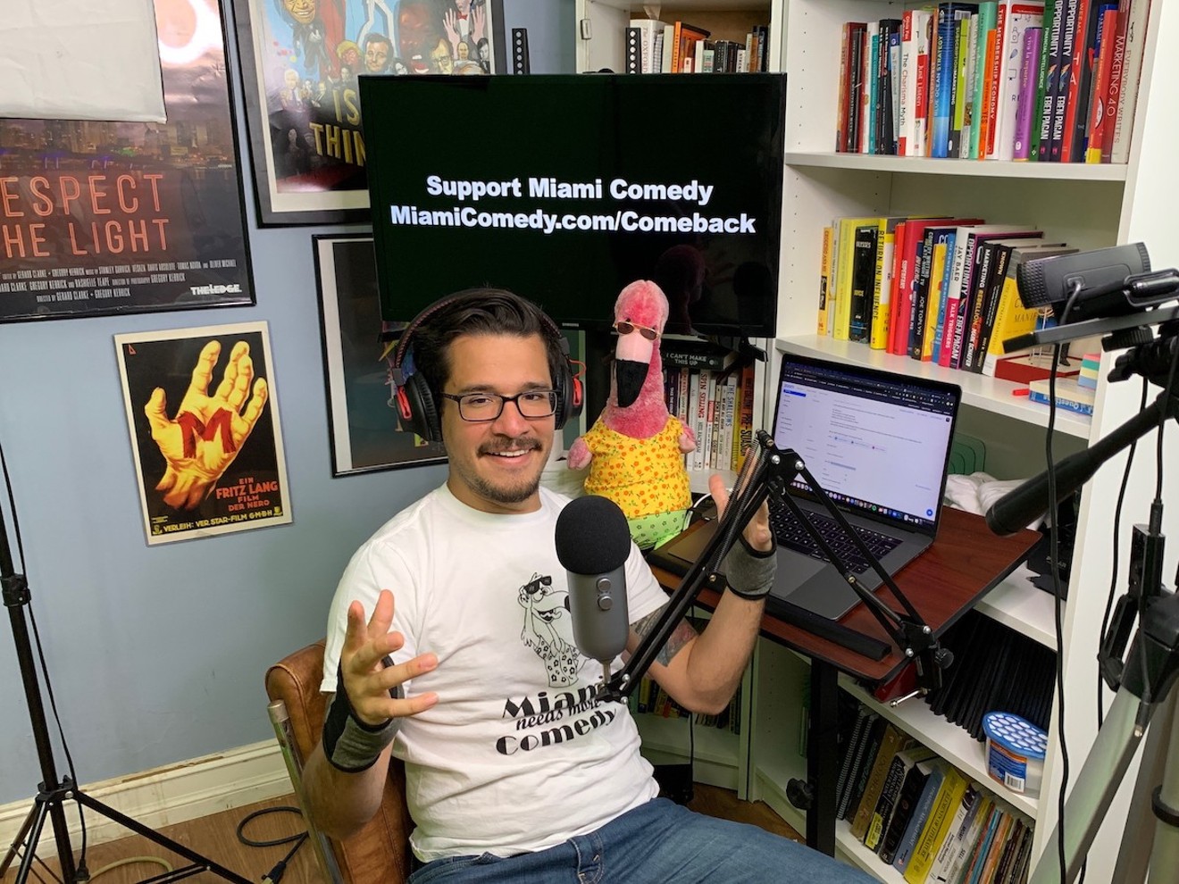 Manny Garavito broadcasts the Miami Comedy podcast from his bedroom.