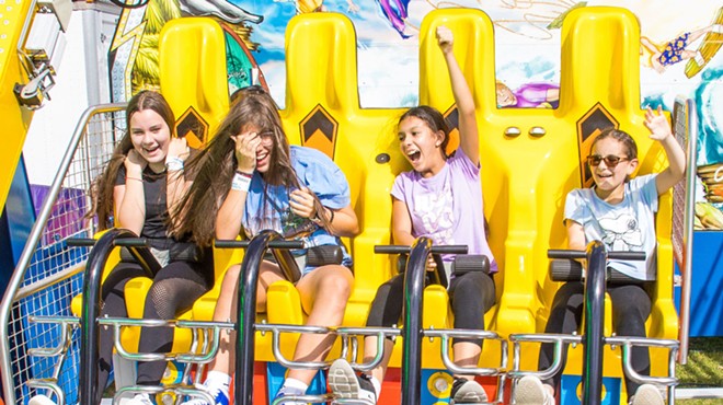 Four young girls on a carnival ride