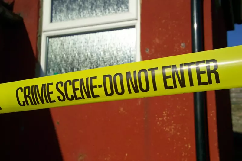 Image: Police caution tape at a crime scene.