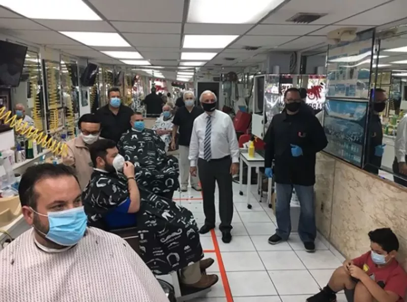 Image: Miami-Dade Mayor Carlos Giménez visits a barbershop in Miami Lakes.