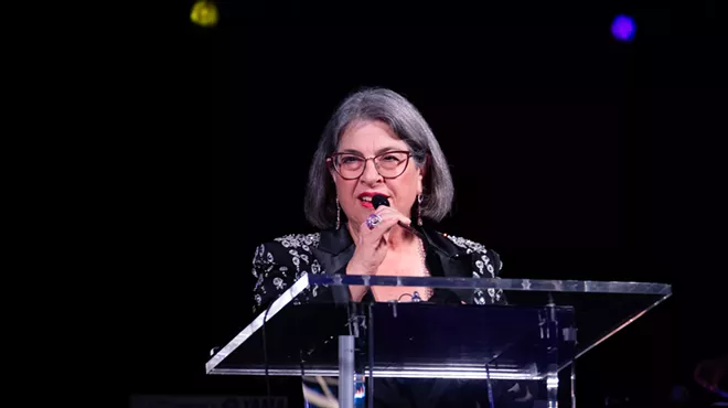 Miami-Dade County Mayor Daniella Levine Cava speaking at a podium during the Miami-Dade Chamber of Commerce’s 19th Annual Holiday Gala