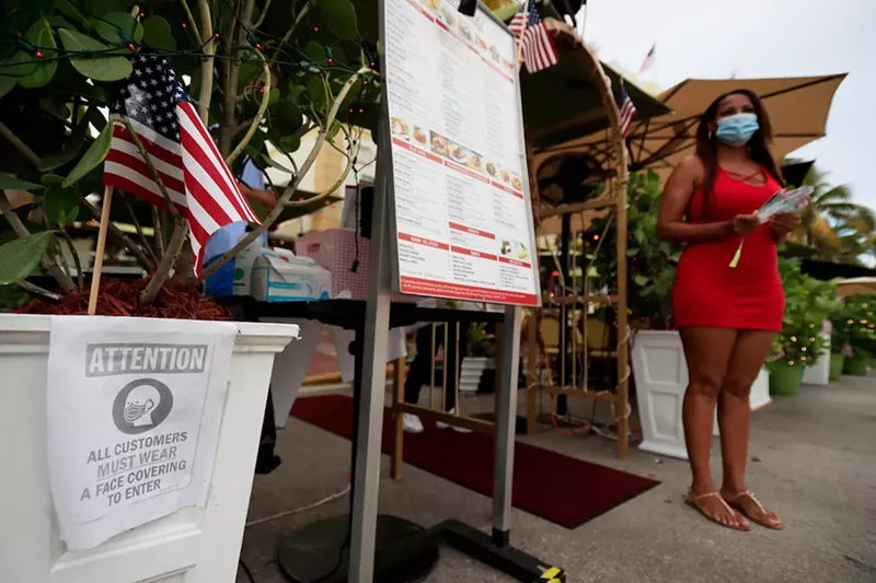 Image: Citing the COVID-19 spike, Miami-Dade Mayor Carlos A. Giménez has again banned on-premises dining throughout the county.