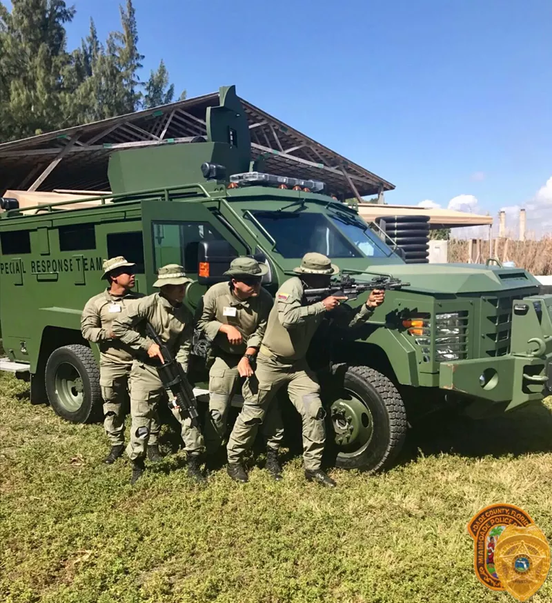 Image: A truck like the one seen in the training exercise above will be deployed at random Miami-Dade County buildings from now on. (The officers in the photo above are not MDPD cops.)