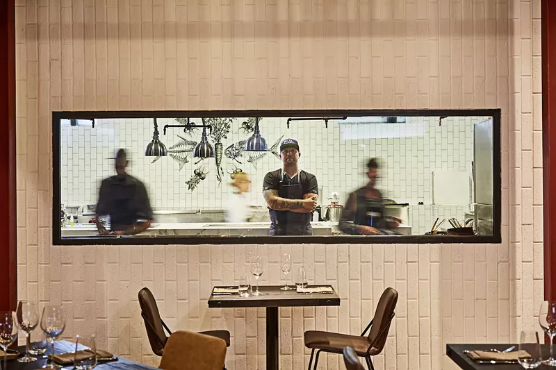 Image: Stubborn Seed executive chef Jeremy Ford inside the kitchen of his busy Miami Beach restaurant.