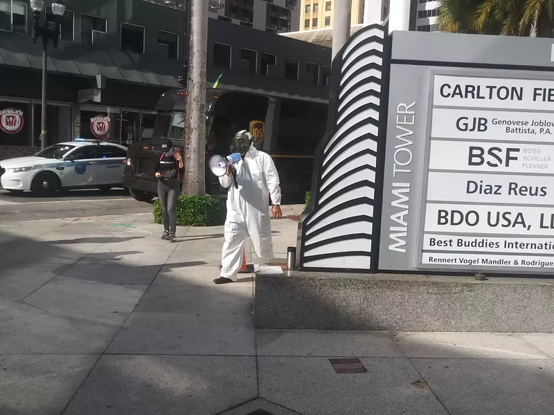 Image: Janitorial workers protest outside the Miami Tower.