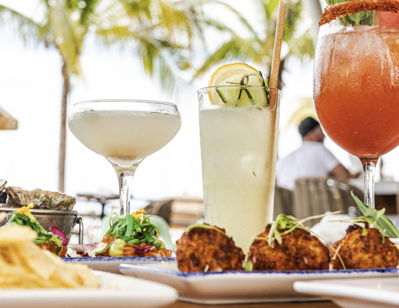 Image: Celebrate the best bars in Miami at an exclusive Miami New Times member happy hour on June 12 at Bayshore Club in Coconut Grove with bites and cocktails.
