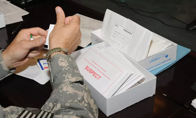 Image: A U.S. military doctor in Afghanistan demonstrated how to use a rape kit to collect evidence.