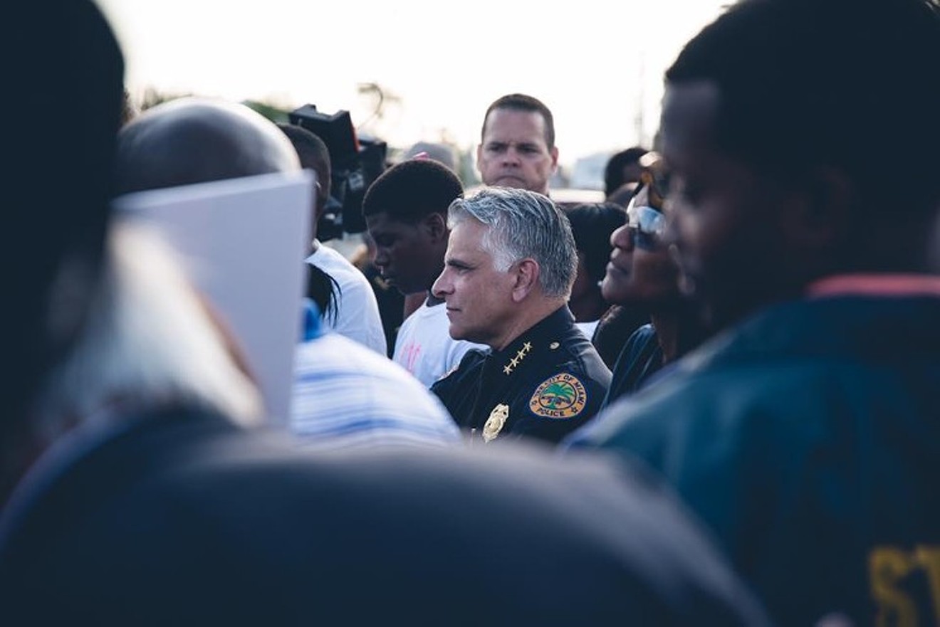 Miami Police Chief Jorge Colina (center)
