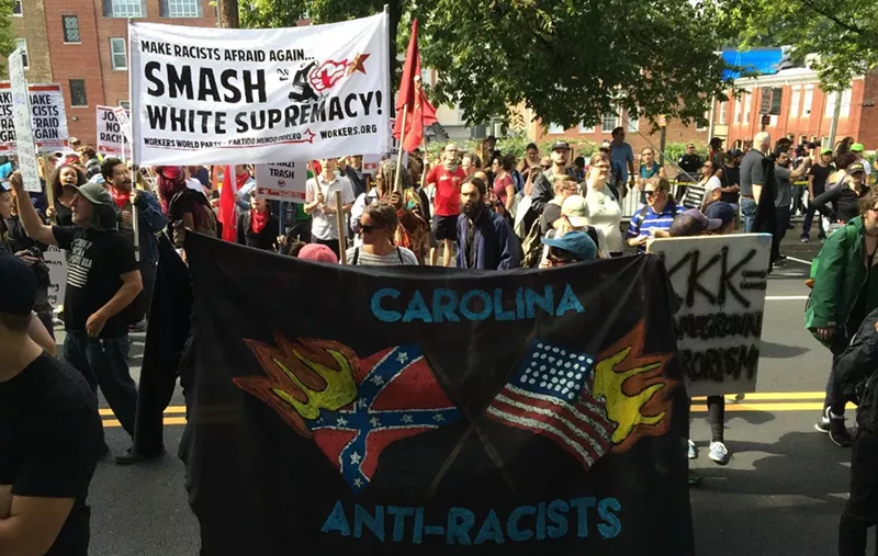 Image: Anti-racism protesters in Charlottesville yesterday before a domestic terrorist plowed a car into the crowd.