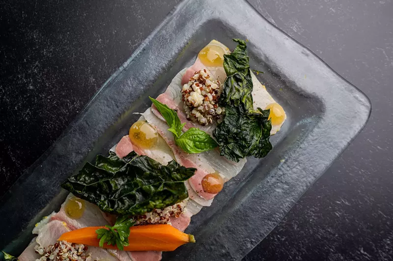 Image: Fine herbs-marinated hamachi crudo at Doma.