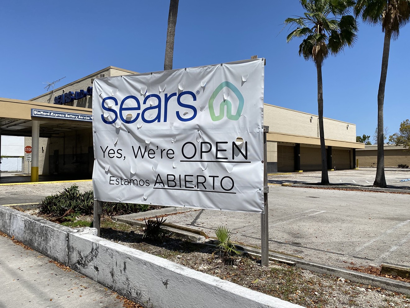 A worn sign outside Miami's last Sears store on March 27, 2022.