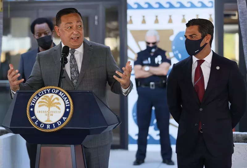 Image: Miami's new police chief, Art Acevedo, speaks to the media alongside Mayor Francis Suarez during his introduction at City Hall.