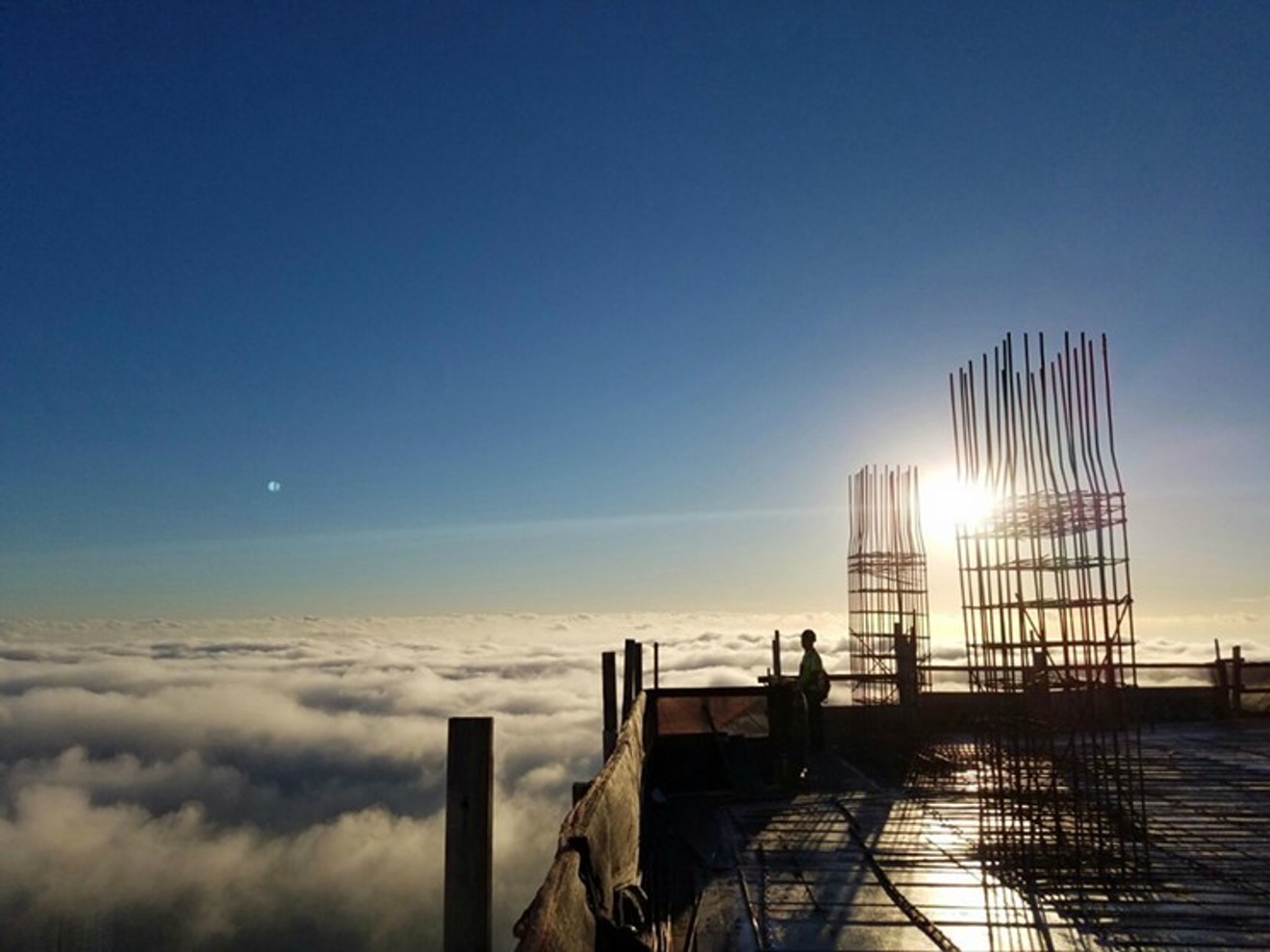 Workers above the clouds at the Panorama Tower in Brickell.