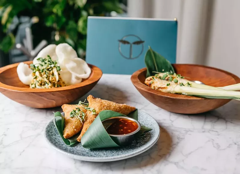 Image: Young coconut salad with curry chicken (left), samosas, and sale lilit are some of the menu highlights at Sling Bar.