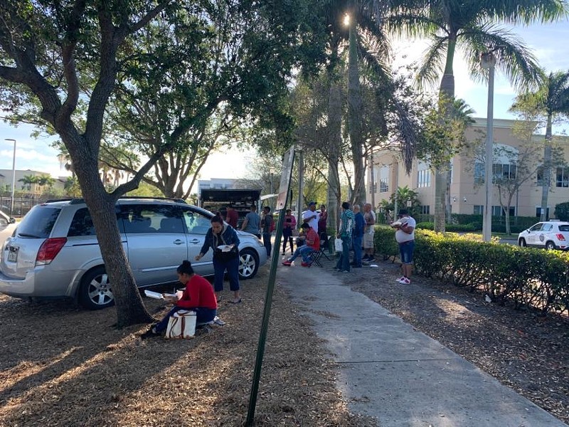 A food truck serves hungry immigrants taking a break from the long lines outside the Broward County ICE facility in Miramar.