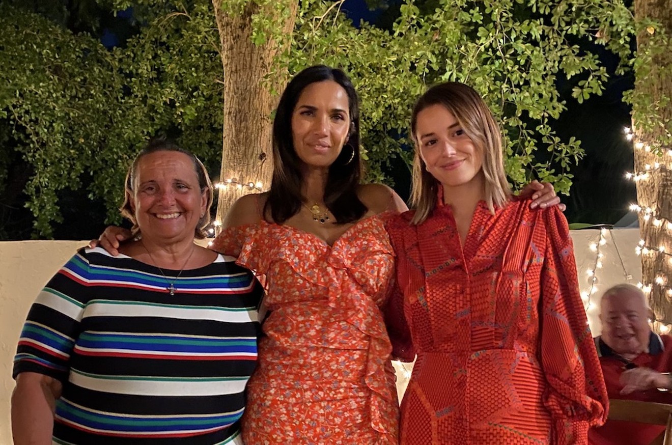 Monica "Mika" Leon and her mother Lupita Estupinan (left) hosted Padma Lakshmi in their home for a Noche Buena celebration.