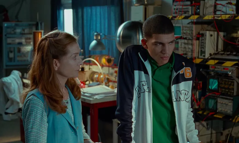 Image: In Mrs. Hyde, Isabelle Huppert (left) plays a teacher who is transformed into a murderous electric sylph after lightning strikes the high school’s laboratory, yet still manages to turn troubled Malik (Adda Senani) into her prize student.