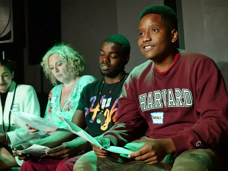 Image: Local actors sit onstage for the Naked Angels cold-reading series at the Speak Easy Theater in the Broadmoor Hotel.