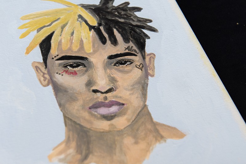 A portrait left at a makeshift memorial outside the XXXTentacion Funeral & Fan Memorial at BB&T Center in Sunrise, Florida, on June 27, 2018