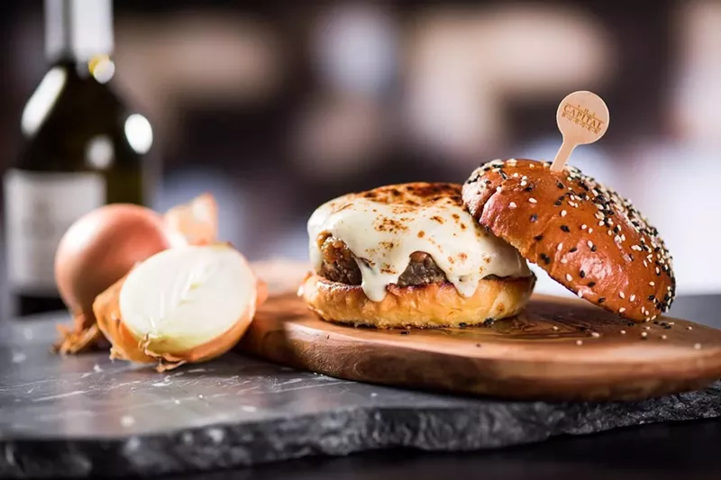 Image: The Capital Burger features signature burgers, craft cocktails, and boozy milkshakes.