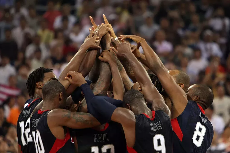 Image: Team USA huddles at center court after defeating Spain to win the gold medal at the 2008 Olympics in Beijing.