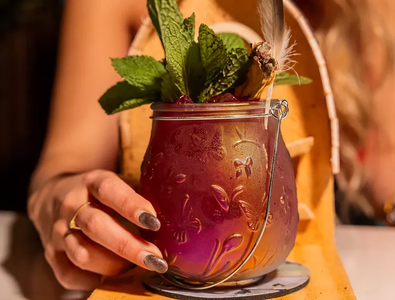 Image: cocktail and hand