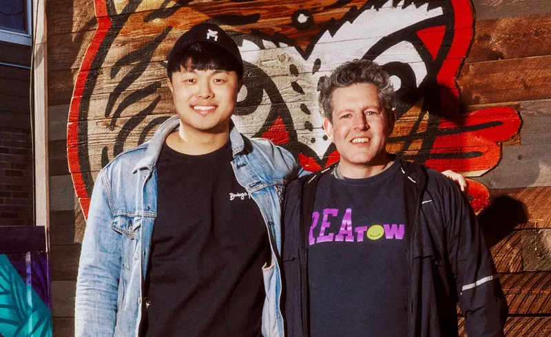 Image: Two men posing for a photo