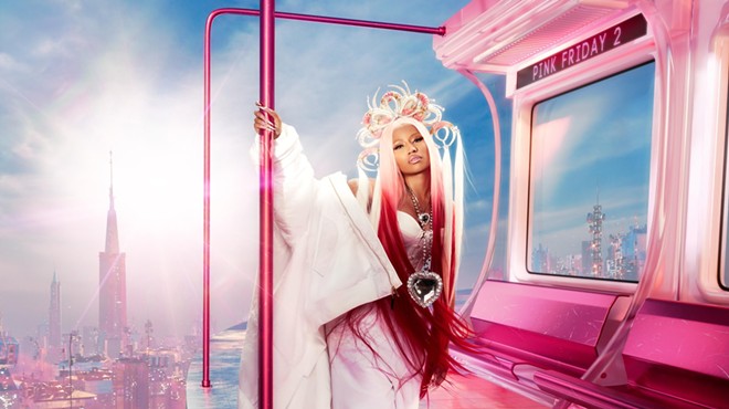 Rapper Nicki Minaj standing in a computer-generated pink train
