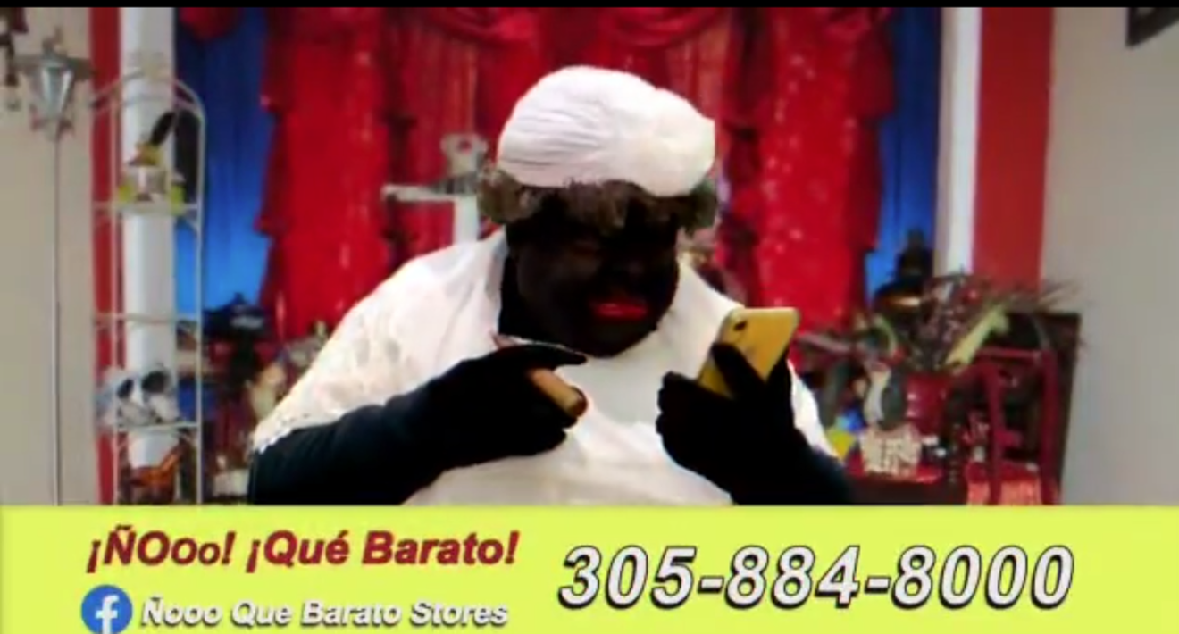 In a commercial for Hialeah department story Ñooo Que Barato, Cuban comedian and TV show host Jose Carlucho performs blackface, in an apparent ploy to sell white clothes for santeria.